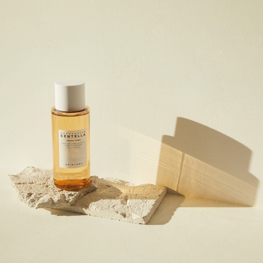 Centella Toning Toner on a textured stone, showcasing its gentle, skin-smoothing formula for daily use.